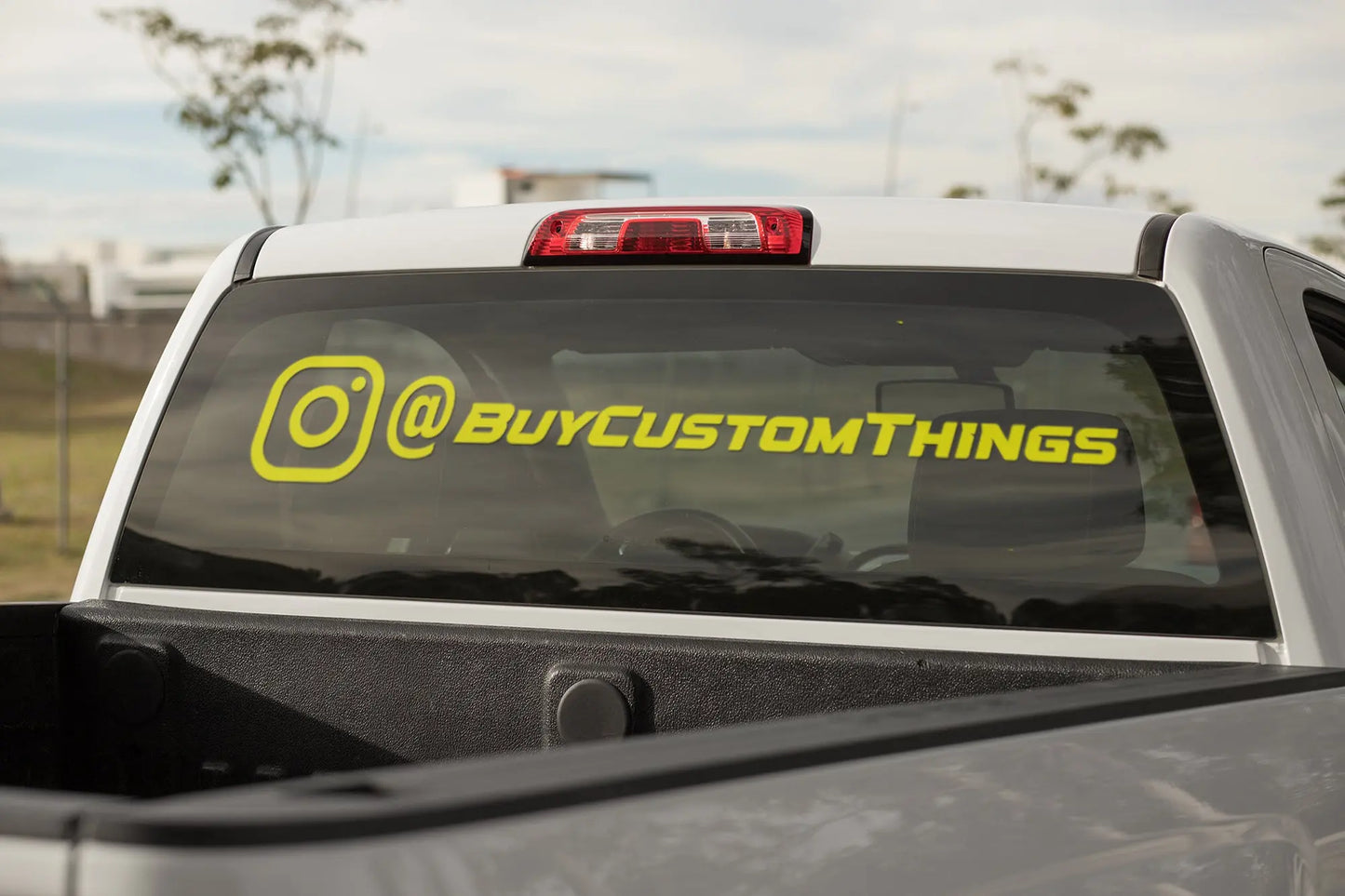 custom social media @ tag weatherproof vinyl decal stickers stuck on a pick up truck window