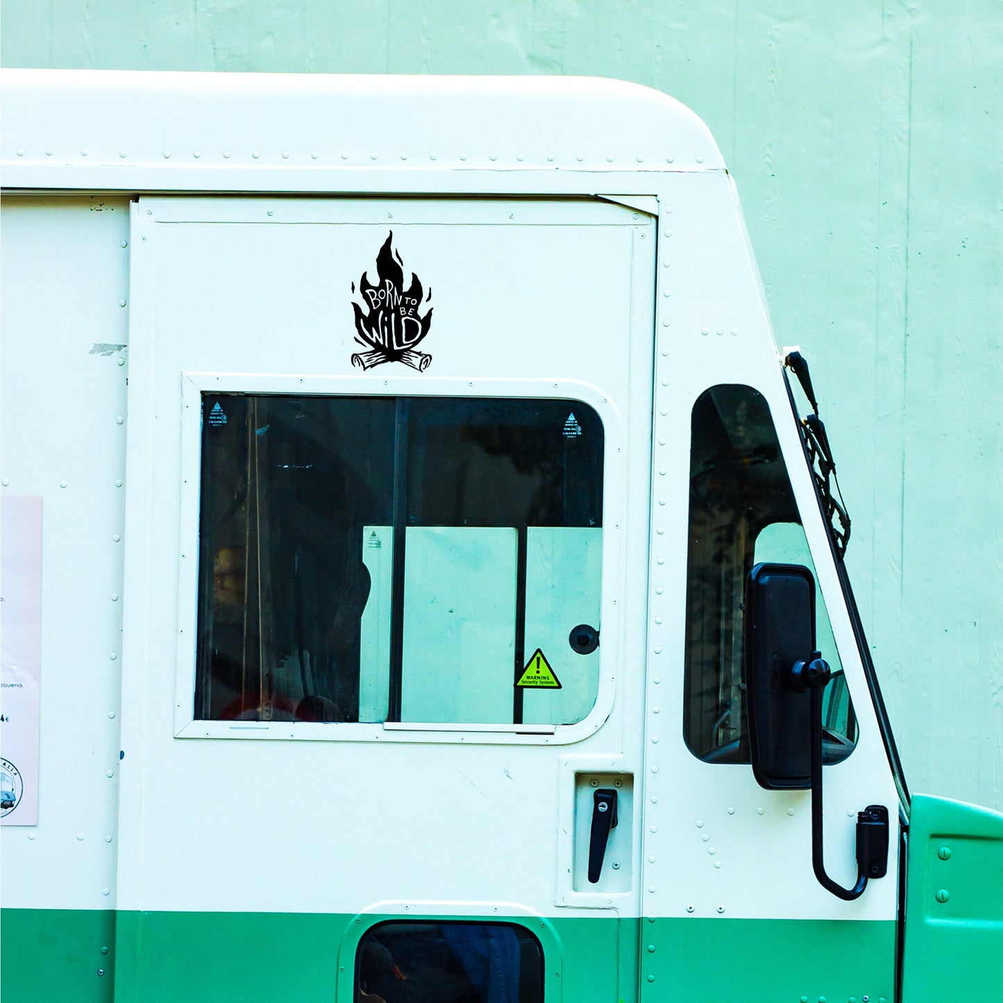 A born to be wild campfire decal stuck on a campervan